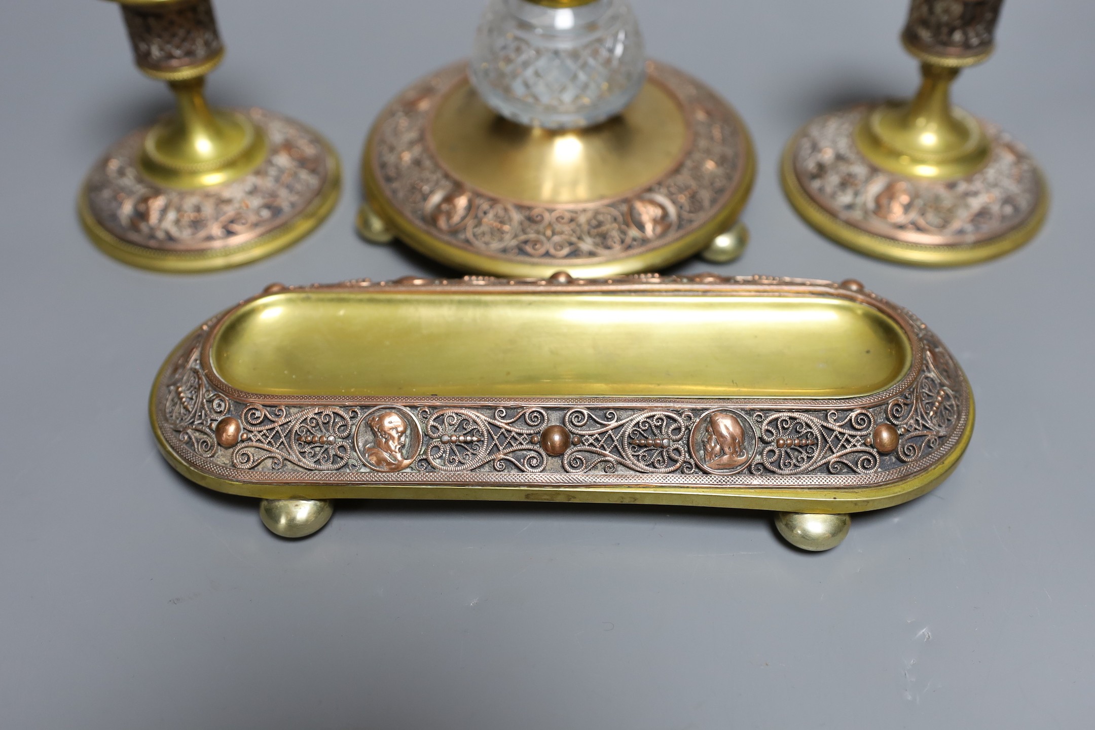 A brass and filigree worked copper desk set (4), inkwell 10.5 cms high